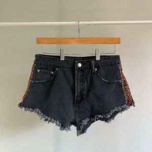 Distressed Black Denim Cutoff Shorts with Tribal Pattern Size 27 US